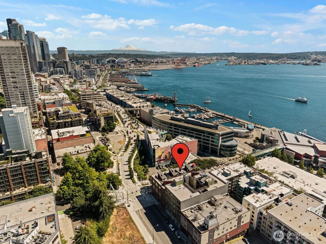 Aerial view of 66 Bell Street, Unit 303, a Seattle Belltown condo listing represented by Wesley Gardner, with the Compass map pin marking the building